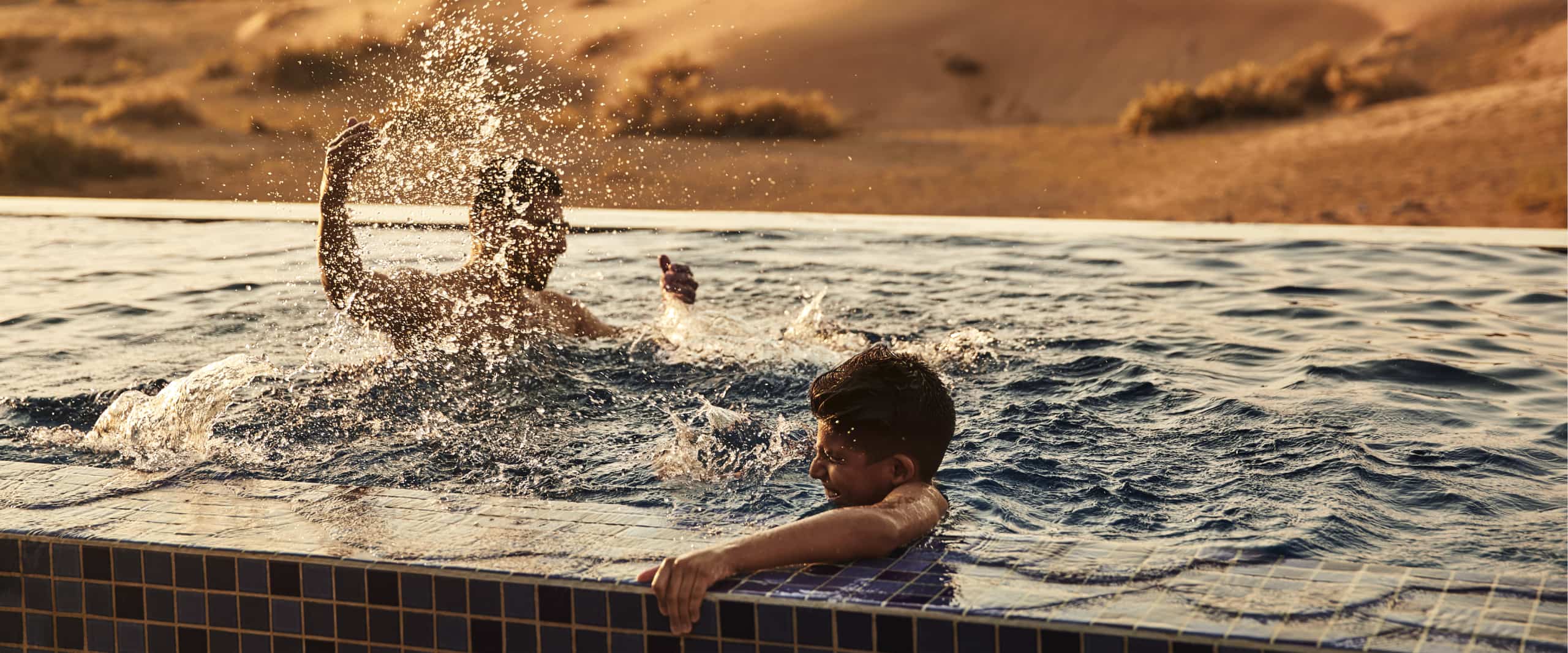 Ritz-Carlton Residences - family in pool