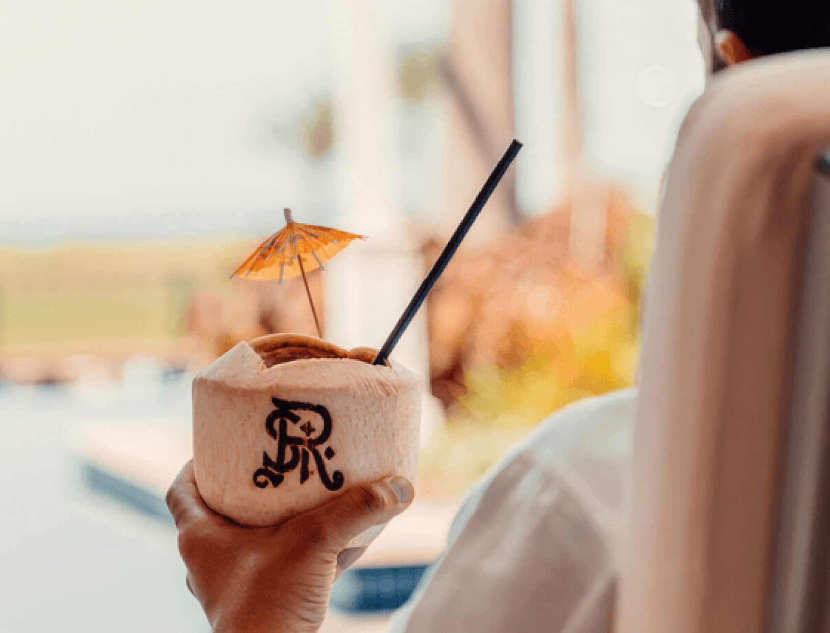 Remarkable Locations - Someone having a drink poolside